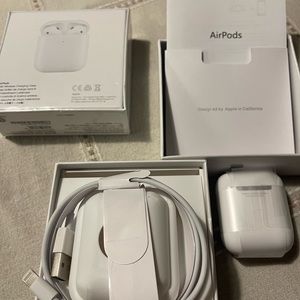 For sale! Brand new air pods. One is opened to show items included.